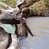 A child in Pokula Boma fetches water, January 28.  