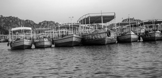 Boats near the Aswan Dam in Egypt. (photo: Unsplash | Hamed Taha)