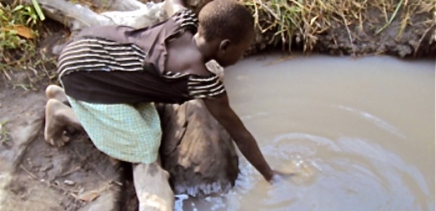 A child in Pokula Boma fetches water, January 28. 
